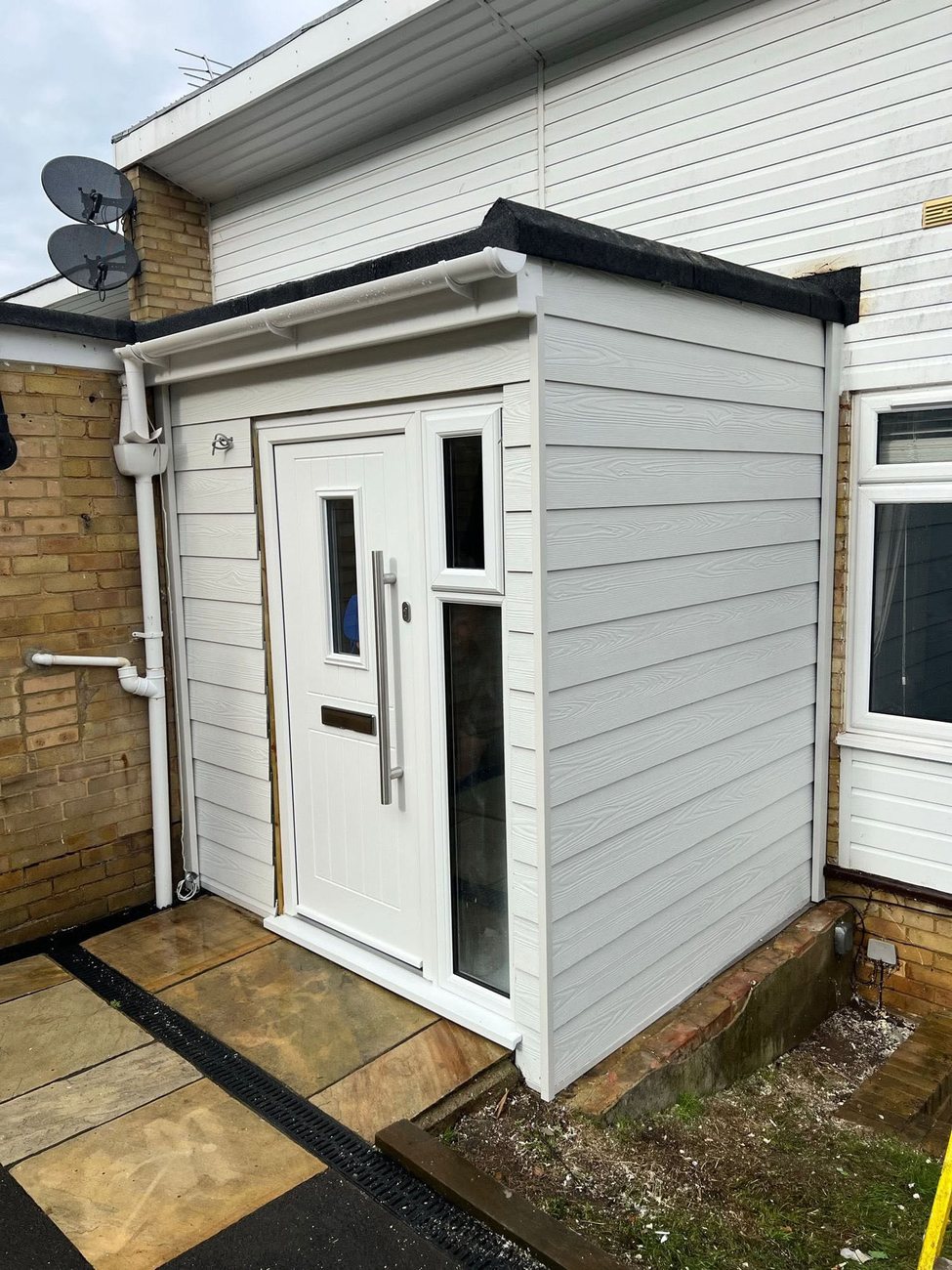 Finished rendered and clad porch with new composite door